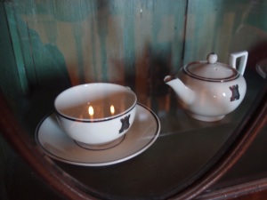 The Great House's custom-made China pattern, displayed in a cabinet on the second floor landing.